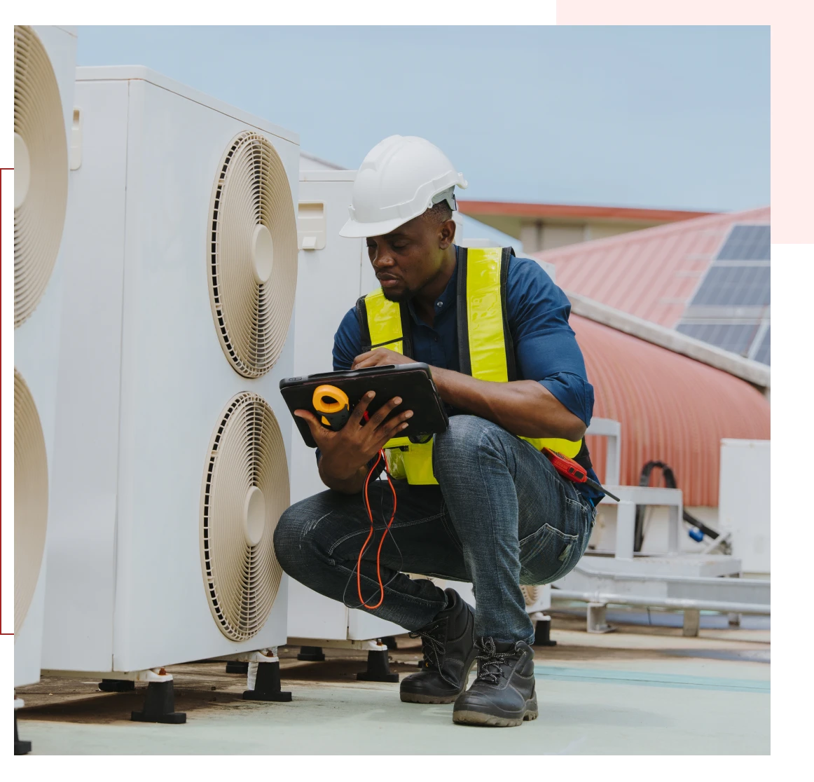 Technician inspecting HVAC unit with tools.